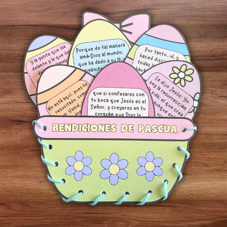 May include: A colorful Easter basket craft with six pastel-colored eggs, each with a different Bible verse about the resurrection of Jesus. The basket is decorated with flowers and a blue ribbon.