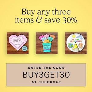 May include: An image with three decorative items on a wooden background. The items include a heart-shaped card, a flower pot with prayer cards, and a circular design with a lion. Text includes "Buy any three items & save 30%" and "BUY3GET30 at checkout."