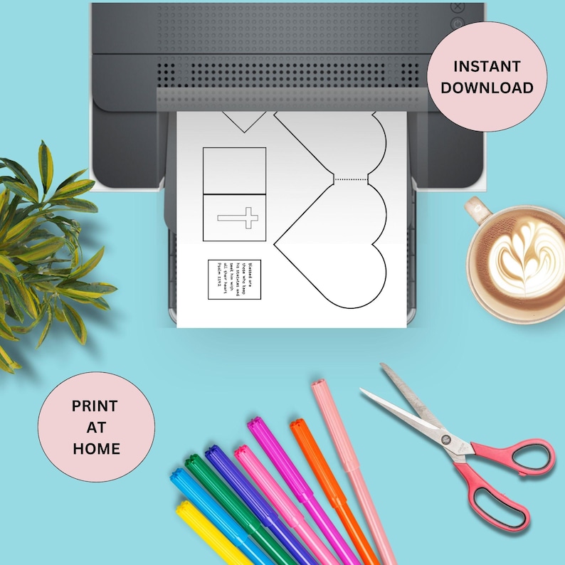 May include: Printable craft template for a heart-shaped card with a cross and a Bible verse. The template is printed on a white sheet of paper and is ready to be cut out and decorated. The image also shows a set of colorful markers, scissors, and a cup of coffee.