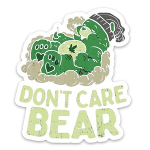 May include: Green cartoon bear wearing a beanie hat and smoking a joint. The bear is surrounded by smoke clouds and the text "Don't Care Bear" is below the bear.