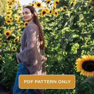 May include: A woman wearing a brown cardigan and blue jeans stands in a field of sunflowers. The text "PDF PATTERN ONLY" is displayed on a brown rectangle.
