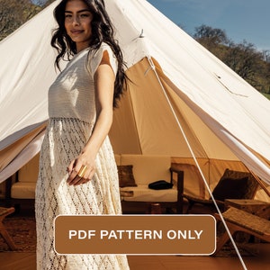 May include: A white crochet dress with a delicate pattern. The dress is worn by a woman standing in front of a large, white canvas tent with brown accents. The text "PDF PATTERN ONLY" is displayed on a brown rectangle in the lower right corner of the image.