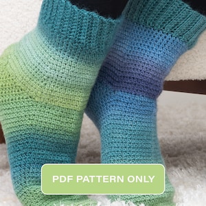 May include: A pair of crochet socks in a gradient of green, blue, and purple. The socks are shown on a person's feet. The text "PDF PATTERN ONLY" is on a green button.