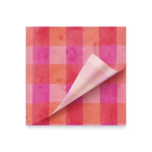 May include: A square sheet of paper with a vibrant, textured gingham pattern in shades of pink and red. A corner of the paper is curled up, revealing a striped pattern on the underside. The paper has a slightly aged appearance.