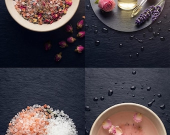 May include: A four-part composition featuring a bowl of pink salt with dried flower buds, a glass dropper bottle of oil with a pink rose and lavender sprigs, piles of pink and white salt with rosemary, and a bowl of pink liquid with rose petals.
