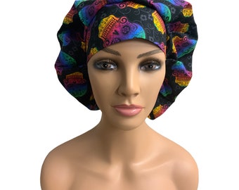 May include: A black scrub hat with a colorful sugar skull pattern. The hat is made of a soft, comfortable fabric and is perfect for nurses, doctors, and other healthcare professionals.