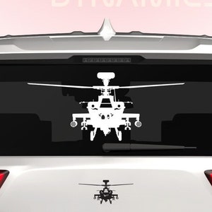 May include: White silhouette of a helicopter on a white car with a Dingo Dynamics logo on the rear window.