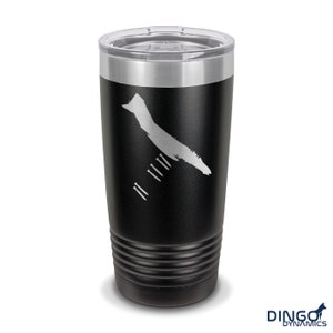 May include: Black stainless steel tumbler with a white outline of a map of an island and the words "DINGO DYNAMICS" on the bottom.