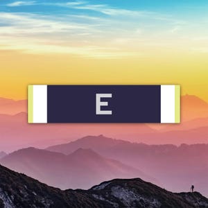 May include: A rectangular graphic with the letter "E" in white, centered on a dark blue background. The graphic has white vertical bars on each side, with a light yellow border. The background features a mountain range under a colorful sky.
