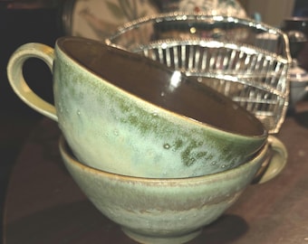 Pottery molted green glaze with brown glaze center set of 2