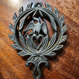 Vintage cast iron trivet eagle design