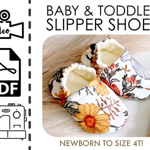 Può includere: Scarpine per neonati con motivo floreale nei toni del giallo, arancione e marrone su sfondo bianco. Il testo recita "Baby & Toddler Slipper Shoes" e "Newborn to Size 4T!"