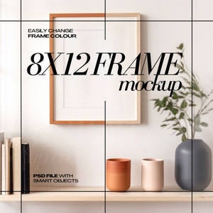 May include: An 8x12 frame mockup with a wooden frame, displayed on a shelf with books, vases, and decorative items. The text "EASILY CHANGE FRAME COLOUR" and "8X12 FRAME mockup" are visible. The image also includes the text "PSD FILE WITH SMART OBJECTS".