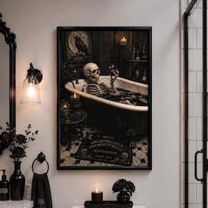 May include: A framed rectangular wall art print featuring a skeleton sitting in a bathtub filled with dark water, holding a small black duck. The scene includes a raven, candles, and a Ouija board on the floor, all rendered in a dark, moody aesthetic.