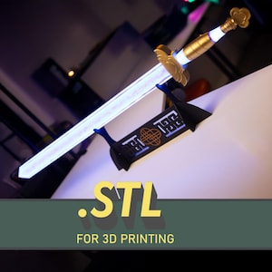 May include: A decorative sword with a glowing white blade, gold accents, and a black stand. The stand features an intricate design. The text ".STL FOR 3D PRINTING" is displayed at the bottom of the image.