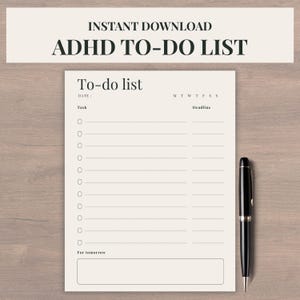 May include: A beige ADHD to-do list printable with the text "INSTANT DOWNLOAD ADHD TO-DO LIST" at the top. The to-do list includes sections for tasks, deadlines, and a space for notes. A black pen rests on the right side of the list.