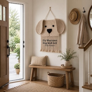 May include: A beige macrame dog wall art piece with black eyes and nose hangs on a white wall. The text "DIY Macrame Dog Wall Art - Free Pattern" is below the dog's face. A bench, pillow, and basket are below.