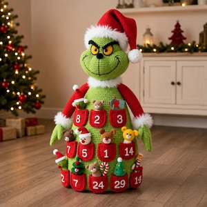 May include: A large green crocheted figure resembling a holiday character wearing a red Santa hat with white trim. The body features multiple red pockets, each embroidered with a white number, containing small crocheted ornaments like bears and trees.