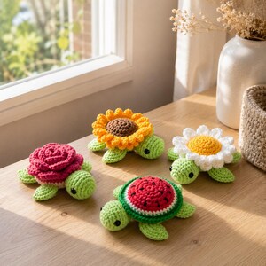 May include: Four small crocheted turtles with light green bodies and black eyes. Each turtle features a unique shell design: one with a red rose, one with a yellow sunflower, one with a white daisy, and one with a red and green watermelon slice.
