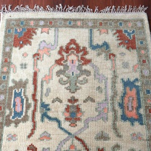 Hand-Knotted Oushak Rug: Cream & Multi-Color Wool Area Rug