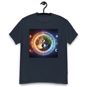 May include: A navy blue t-shirt with a colorful tree of life design. The tree is surrounded by a mandala and a yin yang symbol. The background is a dark blue with stars.