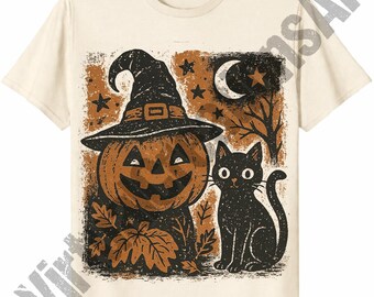May include: A cream-colored short-sleeve t-shirt featuring a graphic print of a jack-o'-lantern wearing a witch hat next to a black cat. The design includes orange and black distressed textures, a crescent moon, stars, and autumn leaves.