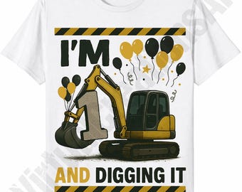 May include: White t-shirt with a yellow and black excavator graphic. The design includes the text "I'M 1 AND DIGGING IT" with yellow and black balloons. The number 1 is incorporated into the excavator's bucket.