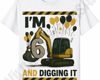 May include: White t-shirt featuring a yellow and black excavator graphic with the number 6. The text "I'M 6 AND DIGGING IT" is printed on the shirt, along with yellow and black balloons. The design includes black and yellow striped borders.