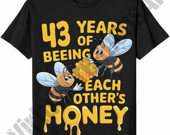 May include: Black t-shirt with a yellow graphic that reads "43 Years of Beeing Each Other's Honey." The design features two cartoon bees holding a honeycomb. The word "Honey" is dripping.