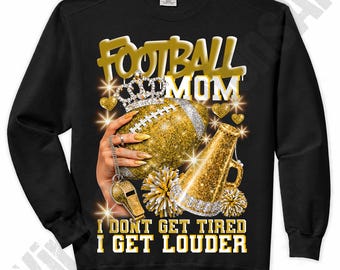 May include: Black sweatshirt with a gold and glitter design. The design includes a football, crown, megaphone, and the words "FOOTBALL MOM" and "I DON'T GET TIRED I GET LOUDER". The design has a sparkly, glamorous aesthetic.