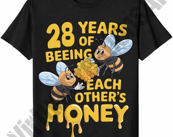 May include: Black t-shirt with a yellow graphic that reads "28 YEARS OF BEEING EACH OTHER'S HONEY." The graphic features two cartoon bees holding a honeycomb. The word "HONEY" is dripping.