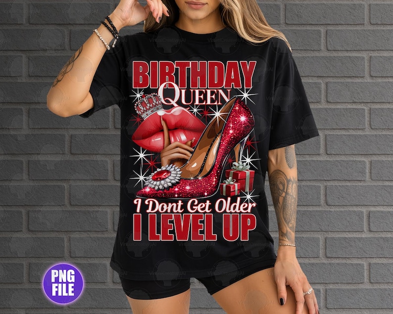 May include: Black t-shirt with a graphic design featuring the text "BIRTHDAY QUEEN" in red, a red high heel shoe, red lips, a crown, and the text "I DON'T GET OLDER I LEVEL UP".