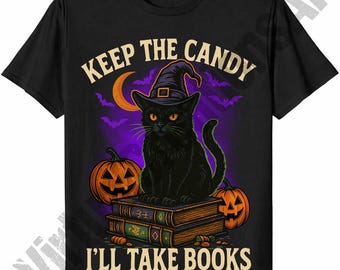 May include: Black t-shirt featuring a Halloween design. A black cat wearing a witch hat sits atop books, with pumpkins on either side. The text reads "KEEP THE CANDY, I'LL TAKE BOOKS" in a Halloween-themed font.
