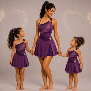May include: Three matching purple dresses with an asymmetrical one-shoulder neckline, a layered skirt, and two circular gold-toned decorative buttons on the bodice. The dresses feature a deep purple fabric with a lighter purple mesh panel across the chest.