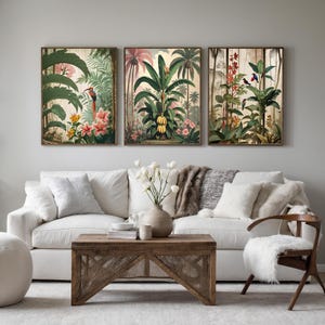 Three framed botanical prints showcase tropical scenes with vibrant flora and fauna. The artwork features colourful birds, banana trees, and various flowers in a vintage style, adding a touch of nature to any interior.