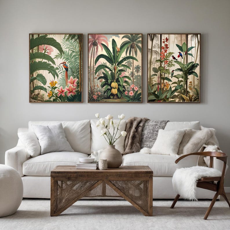 Three framed botanical prints showcase tropical scenes with vibrant flora and fauna. The artwork features colourful birds, banana trees, and various flowers in a vintage style, adding a touch of nature to any interior.
