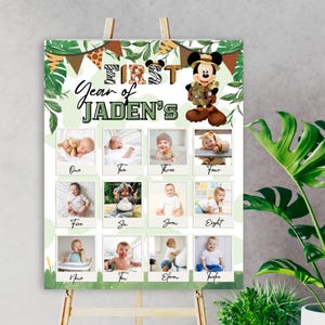 May include: A green and brown jungle-themed first birthday photo collage with a Mickey Mouse character. The collage has 12 photo spaces with the numbers one through twelve written below each space. The text "First Year of Jaden's" is at the top of the collage.