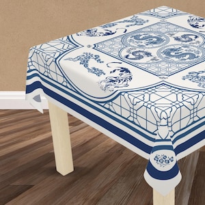 May include: A square tablecloth featuring a white base with blue patterns. The centre displays circular dragon motifs, while the corners and edges are decorated with tiger illustrations and geometric lattice designs. The text Tablecloth Only is visible.