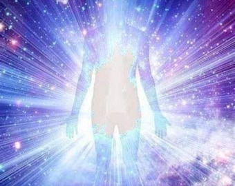 May include: An ethereal image of a human figure radiating light. The figure is a silhouette, with a bright, glowing aura. The background is a cosmic blend of blues, purples, and sparkling stars, creating a sense of energy and spirituality.