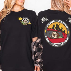 May include: Black t-shirt featuring a cartoon sloth driving a red car, with the text "FLASH" and "100 Yard Dash". The front of the shirt has a smaller version of the sloth and lightning bolt design.