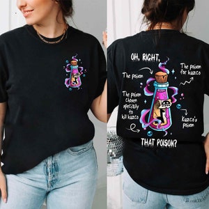 May include: Black t-shirt with a graphic of a purple potion bottle with a skull inside. The back of the shirt has text that reads "OH, RIGHT. The poison chosen specially to kill kuzco. THAT POISON?" with a drawing of a potion bottle and skulls.