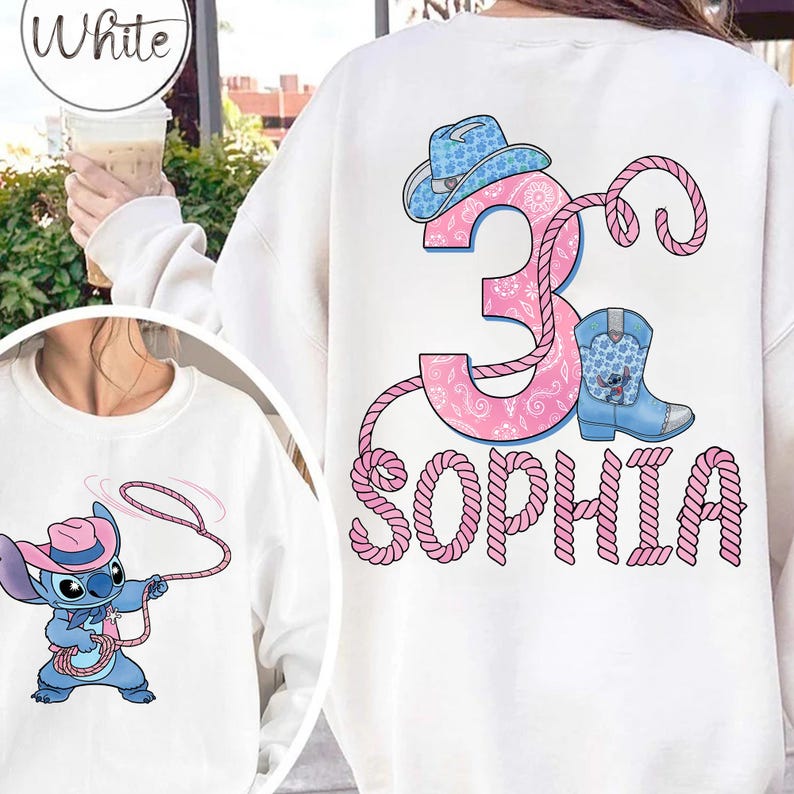 May include: White sweatshirt featuring a cartoon Stitch character with a lasso and a pink cowboy hat. The back of the sweatshirt has a pink number 3, a blue cowboy boot, and the name "SOPHIA" in pink.