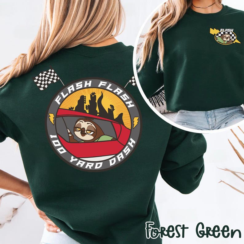 May include: Forest green sweatshirt featuring a cartoon sloth driving a red car with the text "FLASH 100 YARD DASH". The design includes a checkered flag and a yellow lightning bolt. The sweatshirt has a crew neck.