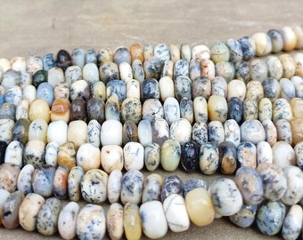 May include: A strand of white, gray, and brown agate beads. The beads are round and have a natural, organic look.
