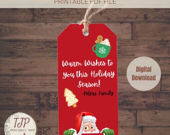 May include: Red printable gift tag featuring Santa Claus peeking out from behind the tag. The tag includes the text "Warm Wishes to you this Holiday Season! -Peters Family" and a cartoon image of a gingerbread man holding a cup of hot chocolate.