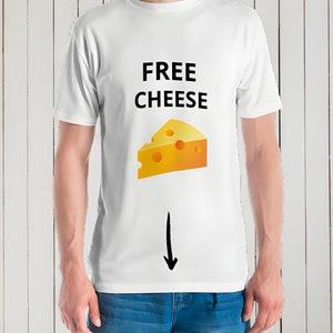 May include: White t-shirt with the text "FREE CHEESE" and a cartoon image of a slice of cheese. A black arrow points down from the cheese.