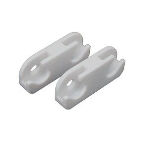May include: Two white plastic clips are shown against a white backdrop. Each clip features a rounded end with a hole and a rectangular slot on top. These clips are designed to secure items.