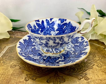 Rare Coalport teacup and saucer set, widemouth with blue leaves and gold gilt trim Made in bone china