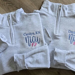 Ash sweatshirts with sky blue thread for the name/NICU and pink thread for the feet.