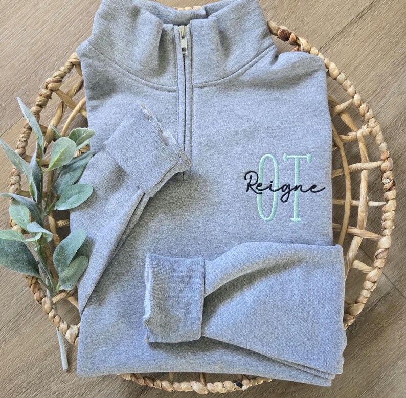 An oxford sweatshirt with mint julep for OT and black thread for the name.